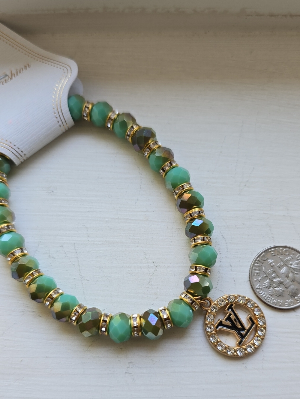 Green Beaded Charm Bracelet with Gold Logo